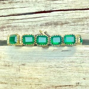 Fossil bracelet. Shiny emerald color gems.